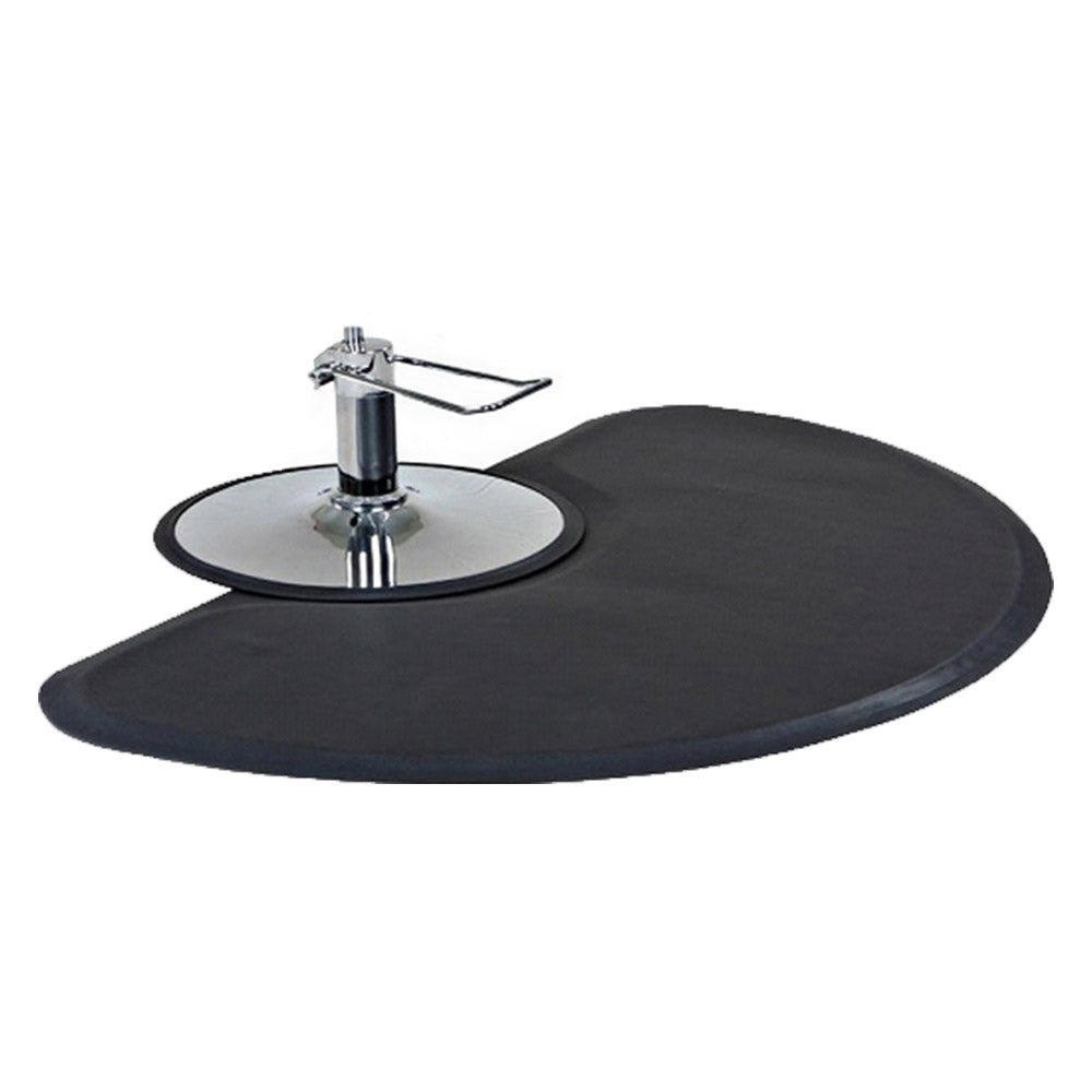 Small black round anti-fatigue floor mat positioned around a chrome salon chair base