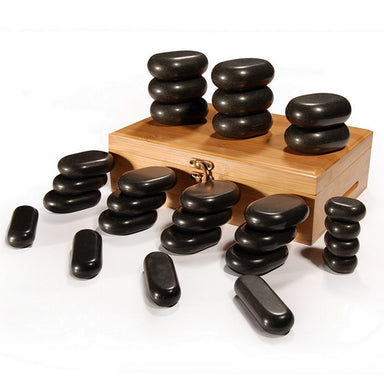 Complete set of 28 black basalt massage stones arranged by size for professional salon use