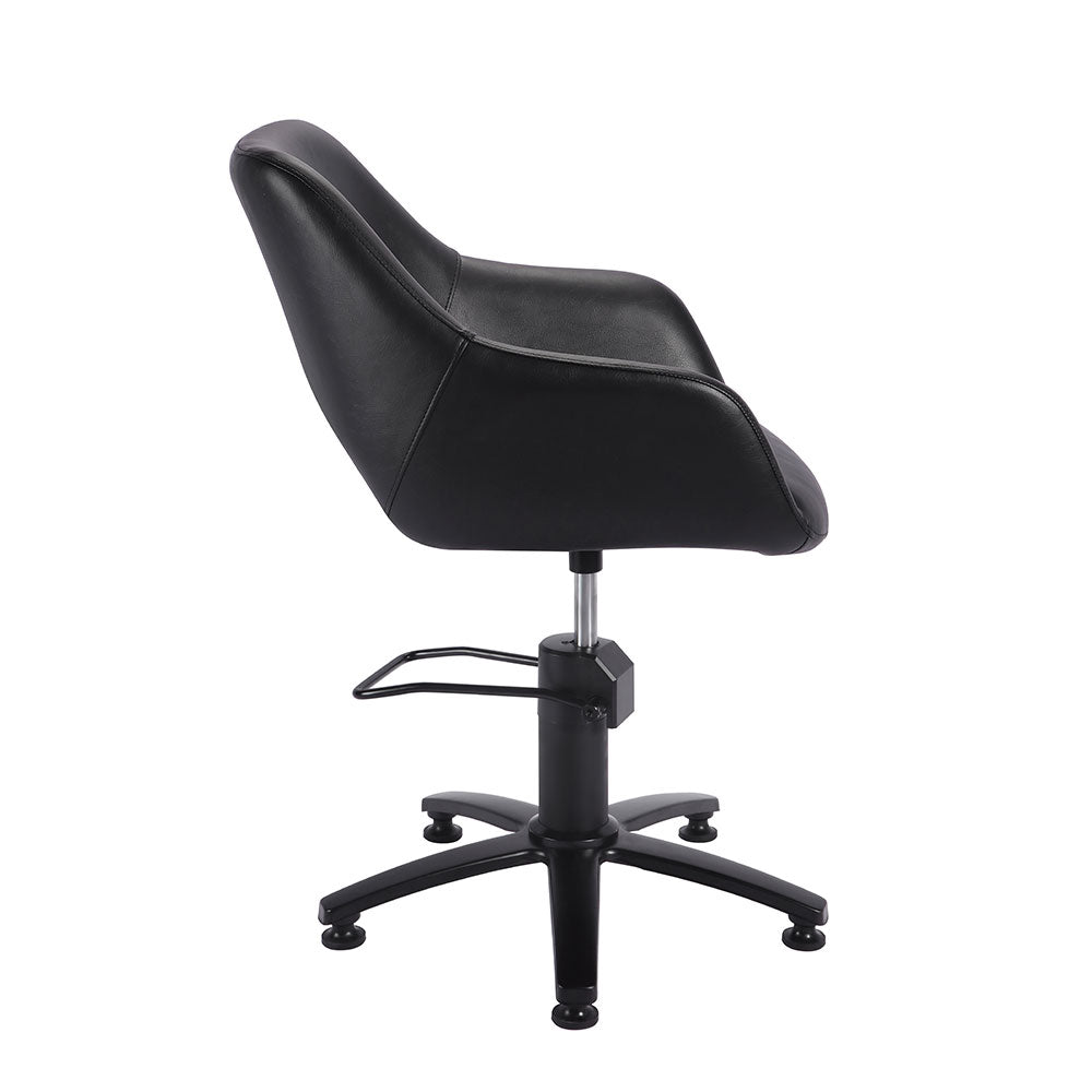 Side view of black professional salon styling chair with curved backrest