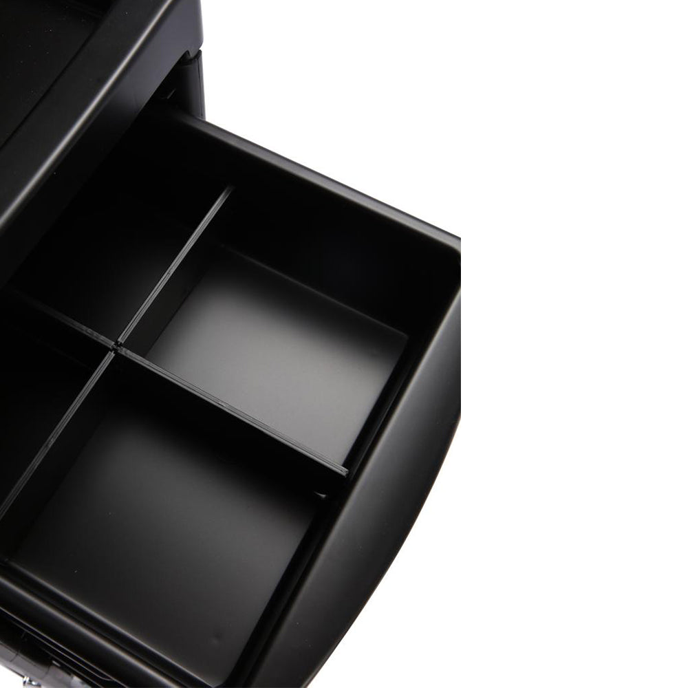 Close-up of salon trolley storage trays for tools and products