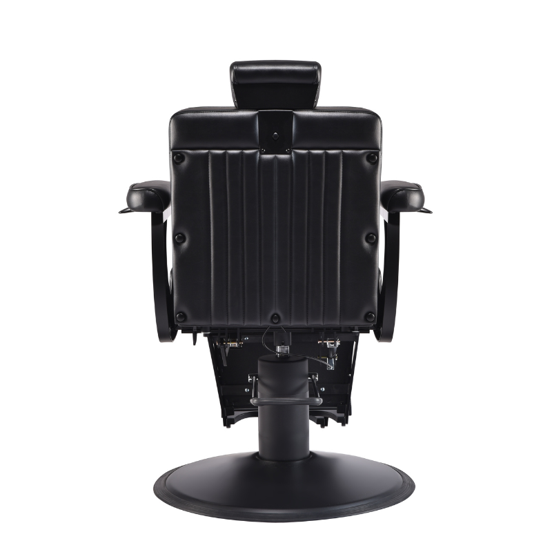 Rear view of black barber chair showing padded backrest and frame