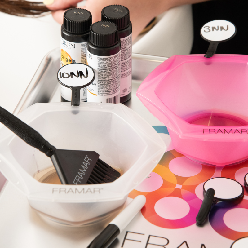 Multiple hair colour bowls in pink and white labelled with Framar Formula Friend clips showing different formulas like 10NN and 3NN