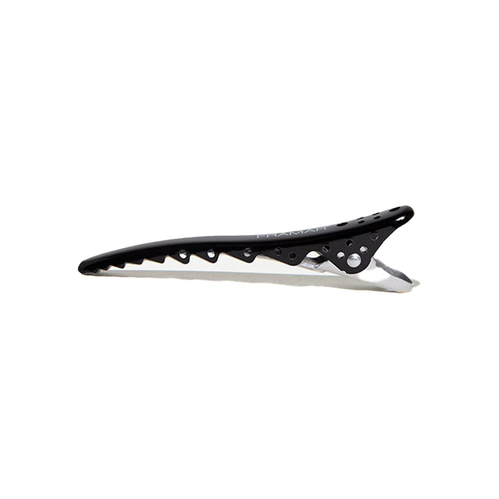 Close up of a black Framar Big Bite Clip showing the serrated edge for extra grip