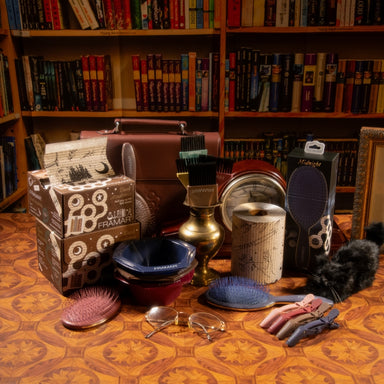 Full set of Framar Dark Academia hair coloring tools including bowls, brushes, and clips on a salon workstation