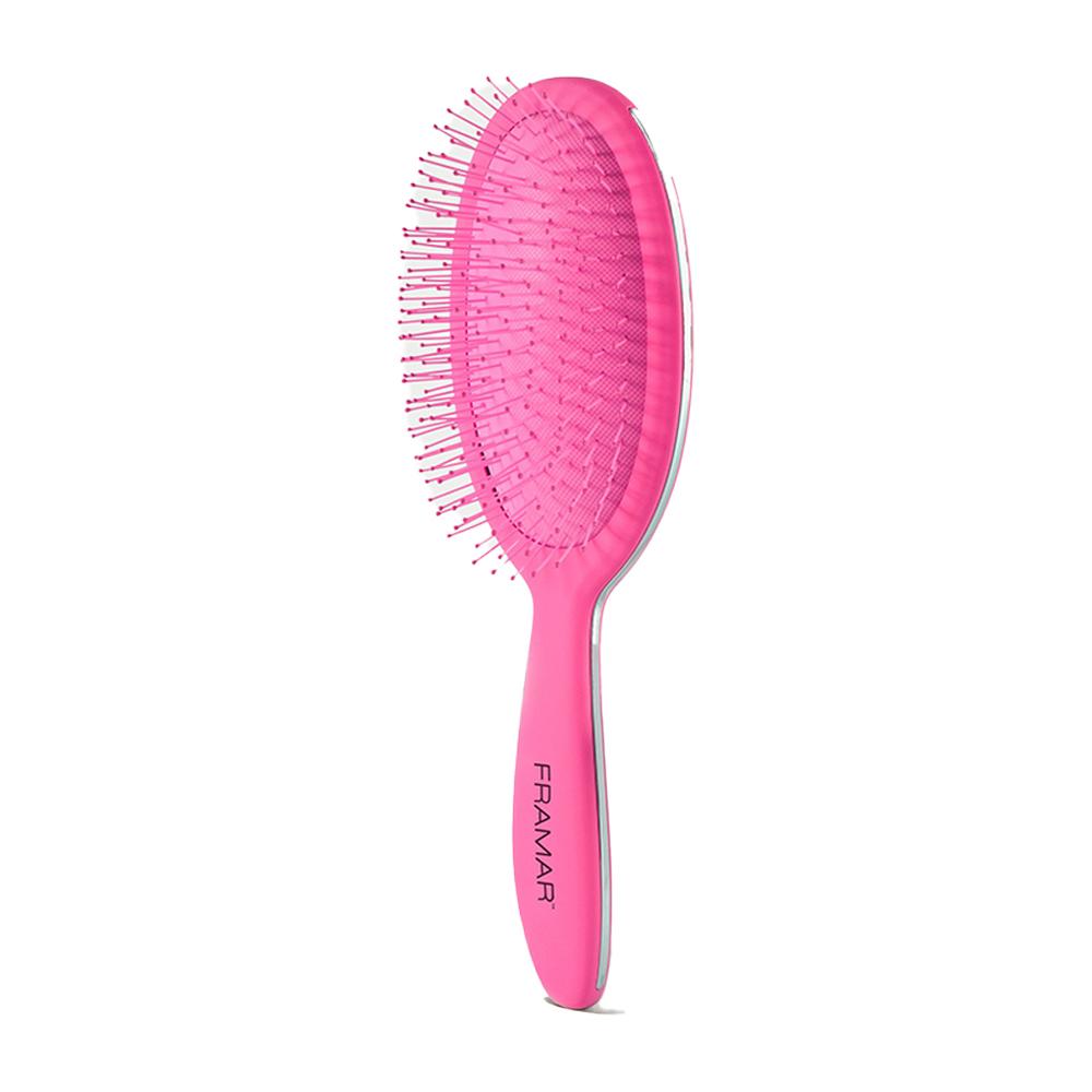 Angled view of the pink Framar detangle brush