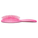 Side view of the pink Framar brush showing the paddle design