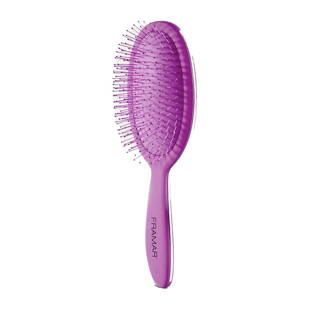 Angled view of the Purple Reign detangle brush showing the bristle density