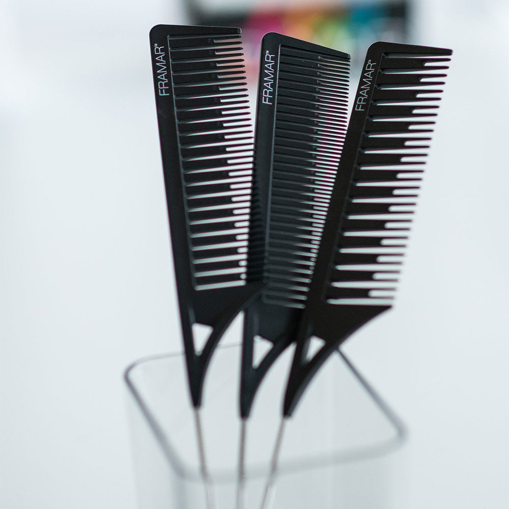 Three black Framar Dream Weaver combs with stainless steel pintails in a salon organiser