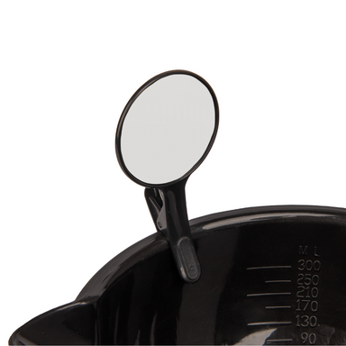 Close up of a black Framar Formula Friend dry erase clip attached to the rim of a professional hair colour mixing bowl