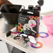Framar Formula Friend clips and marker displayed on a professional salon trolley next to colour bowls and bottles