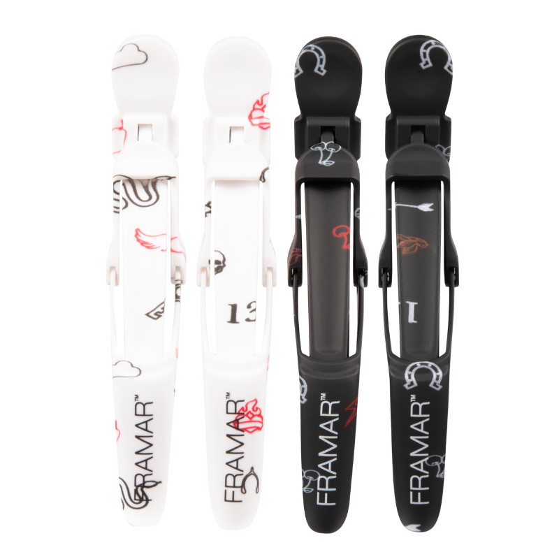 Overhead view of Framar Get Lucky Gator Grips showing black and white rubberised hair clips