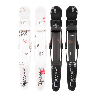 Overhead view of Framar Get Lucky Gator Grips showing black and white rubberised hair clips