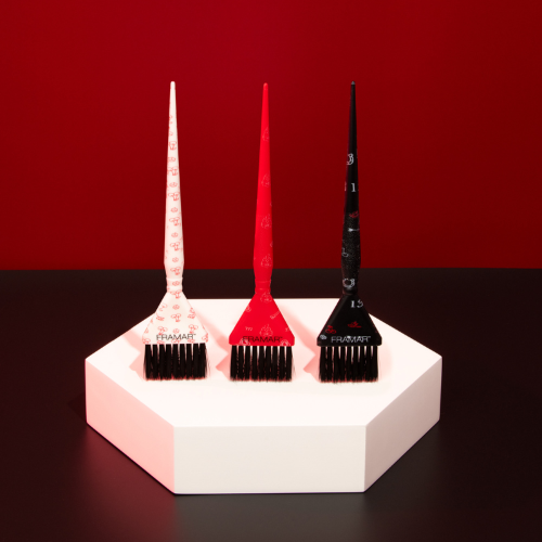 Three Framar Get Lucky tattoo print brushes standing on a white display block