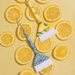 Lifestyle flatlay of Framar Limoncello brushes with fresh lemon slices for salon display