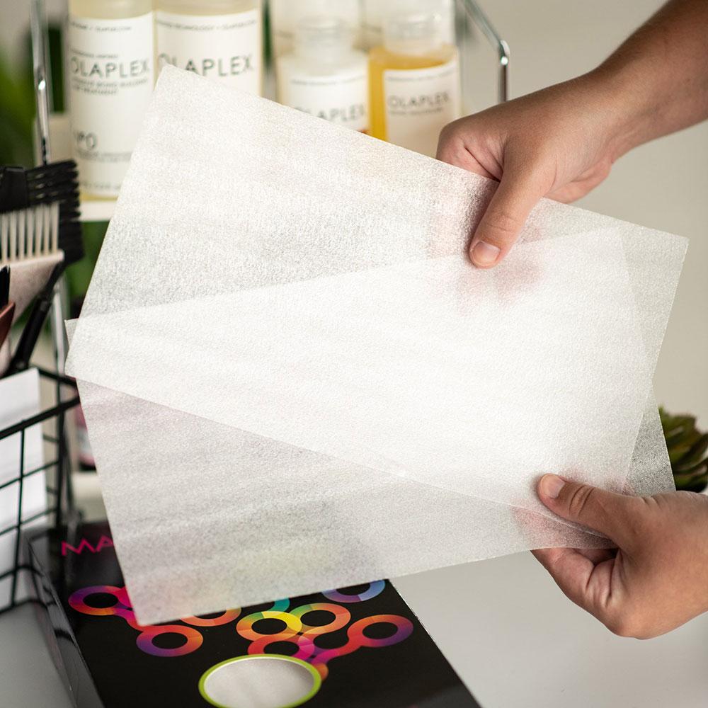 Close up of transparent Framar Maniac Mesh sheets showing the textured grip for professional hair colouring