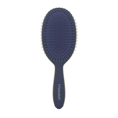 Front view of the Framar Midnight Dark Academia detangle brush showing flexible bristles and midnight blue finish