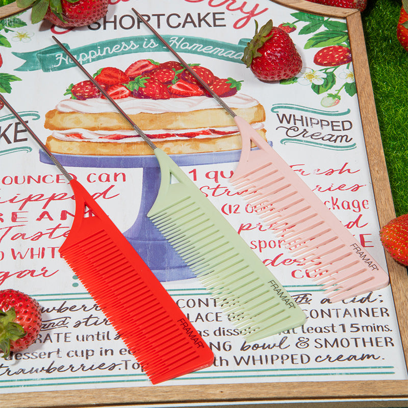 Professional Framar Dreamweaver combs displayed on a strawberry themed background for salon decor inspiration