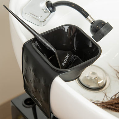 Black Framar Toning Tub suction sleeve and toner bowl attached to a salon shampoo basin with a tint brush