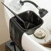 Black Framar Toning Tub suction sleeve and toner bowl attached to a salon shampoo basin with a tint brush