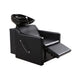 Frenciss shampoo lounge with leg rest extended and black ceramic basin