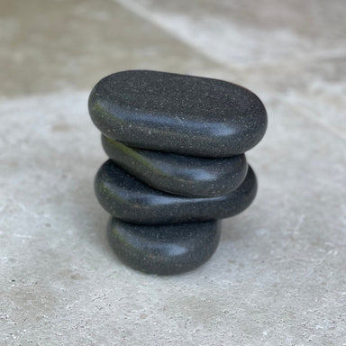 Angled view of Joiken 4 piece basalt hot stone set for beauty therapy and massage