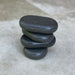 Angled view of Joiken 4 piece basalt hot stone set for beauty therapy and massage
