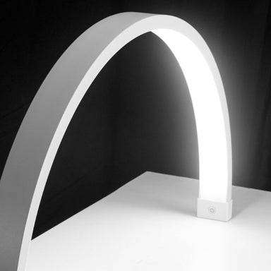 Joiken Arch LED nail table lamp in white providing bright shadow-free lighting for beauty salons