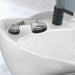 Professional matte black Joiken mixer tap and hand shower installed on a white ceramic salon shampoo basin