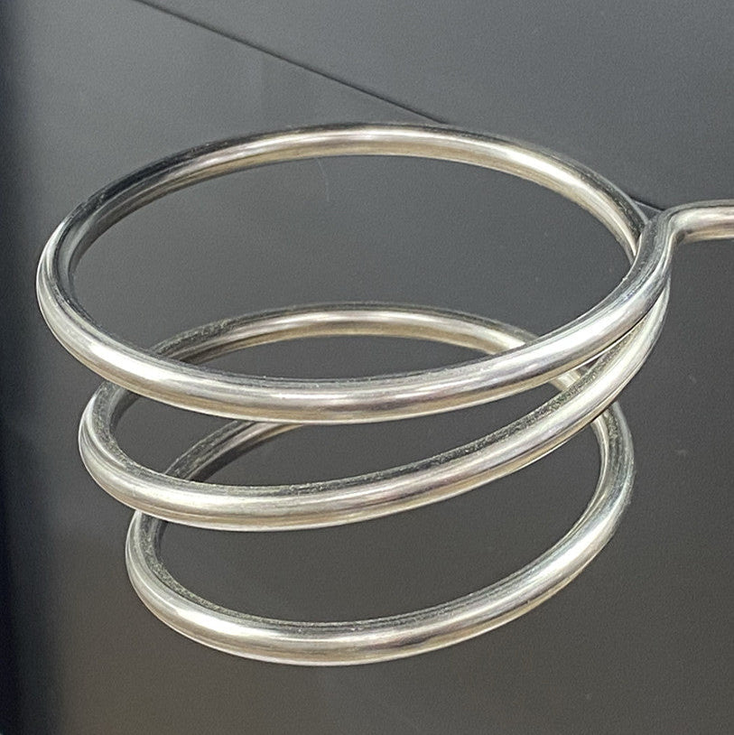 Close up of the integrated chrome hairdryer and tool holder attachment on the Breeze PLUS trolley