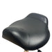 Close up of the ergonomic black contoured saddle seat on the Joiken Brumby stool