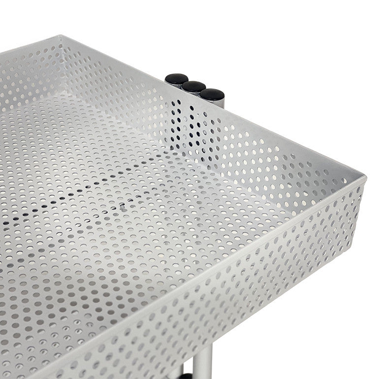 Detailed view of the white mesh storage basket and frame of the Clem beauty trolley