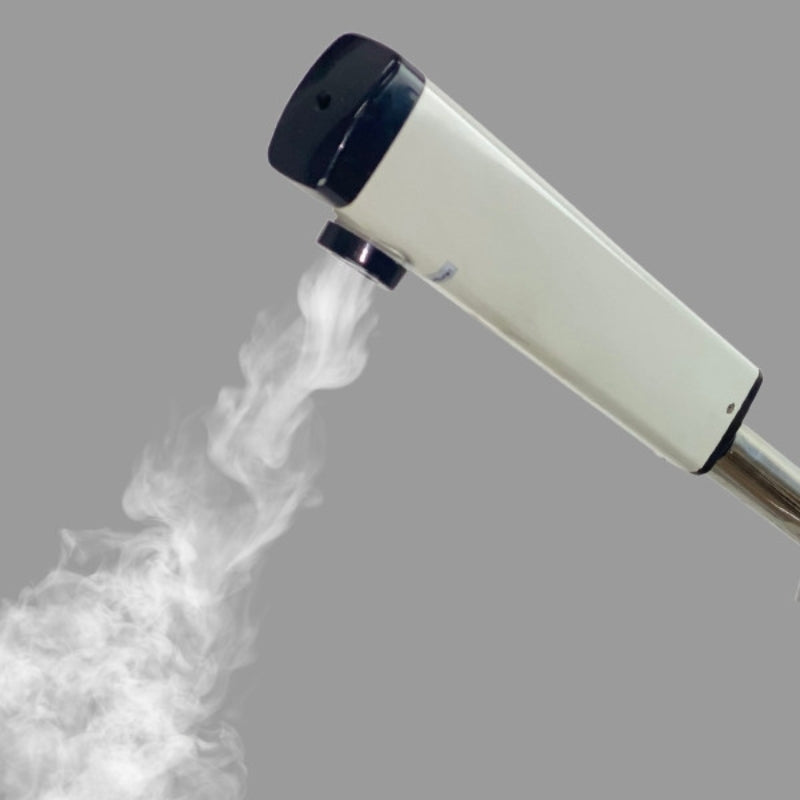 Close up of the white facial steamer head generating steam for professional skin treatments