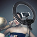 Professional makeup artist using the Joiken Goddess ring light in a salon setting