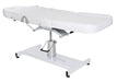 White Joiken hydraulic beauty bed shown in a fully flat treatment position