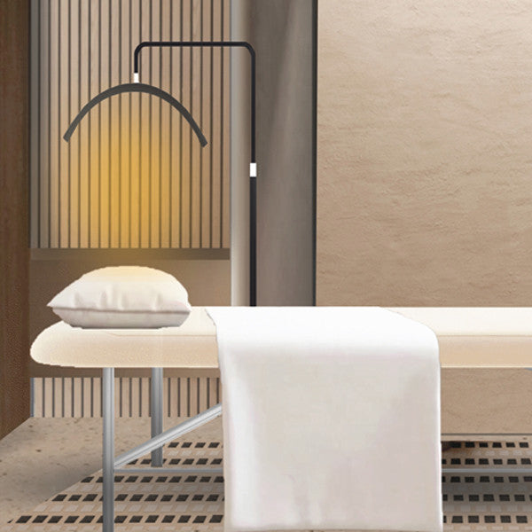 Joiken Moon Light Stand demonstrating the 3200K warm light setting over a professional treatment table