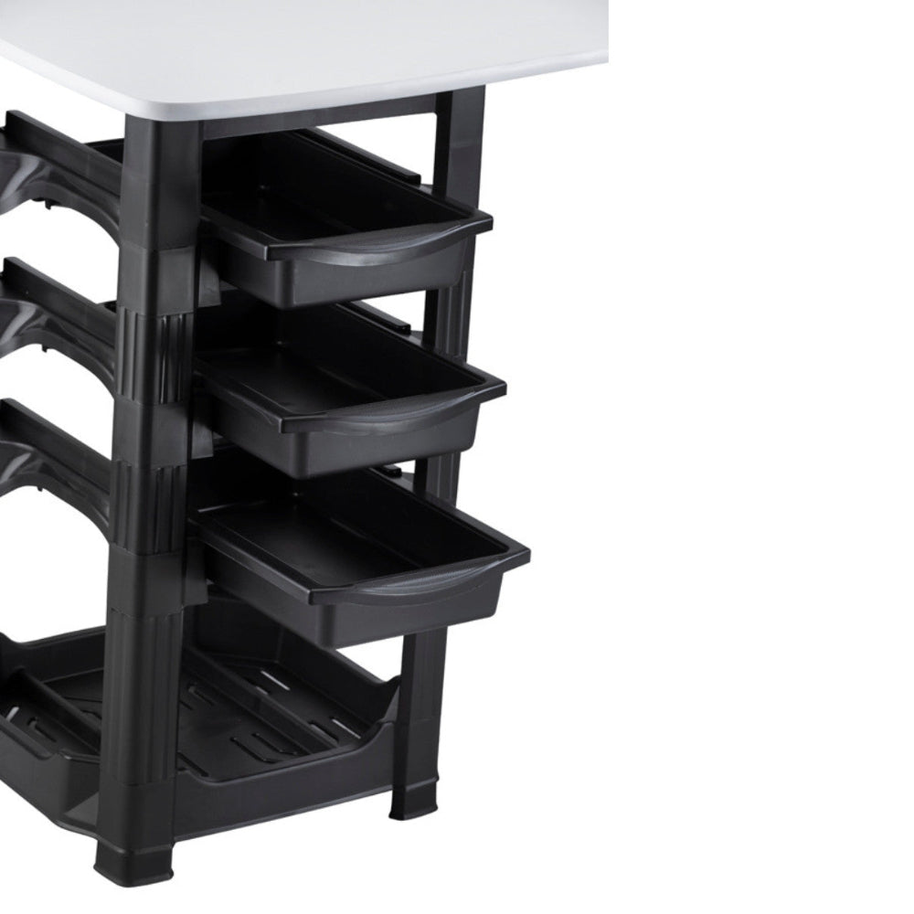 Close up of the three removable black storage drawers on the Joiken Muse manicure table