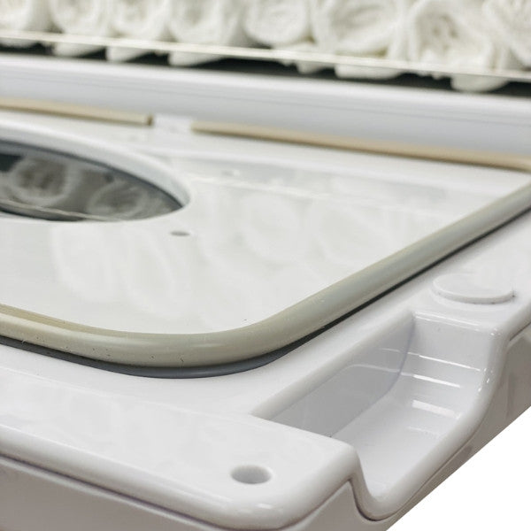 Close up of the removable drip tray and door seal on the Joiken OPAL hot towel cabinet