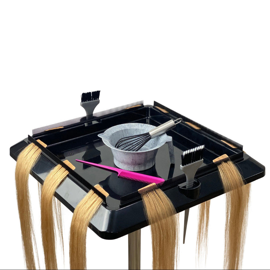 Joiken Pulsar hair extension trolley tray setup with mixing bowl, brushes, and blonde hair extensions