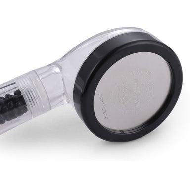 Joiken Rapid Rinse hair salon hand shower showing the internal filtration beads and black rubber bumper