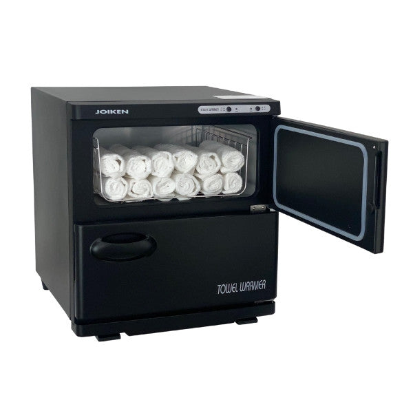 Black Joiken towel warmer with open top door showing rolled white towels inside