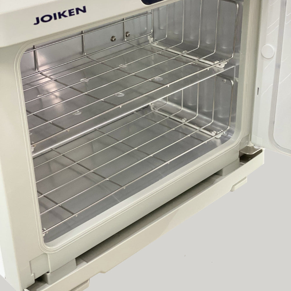 Interior view of the Joiken towel warmer door seal and stainless steel racks