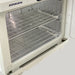 Interior view of the Joiken towel warmer door seal and stainless steel racks
