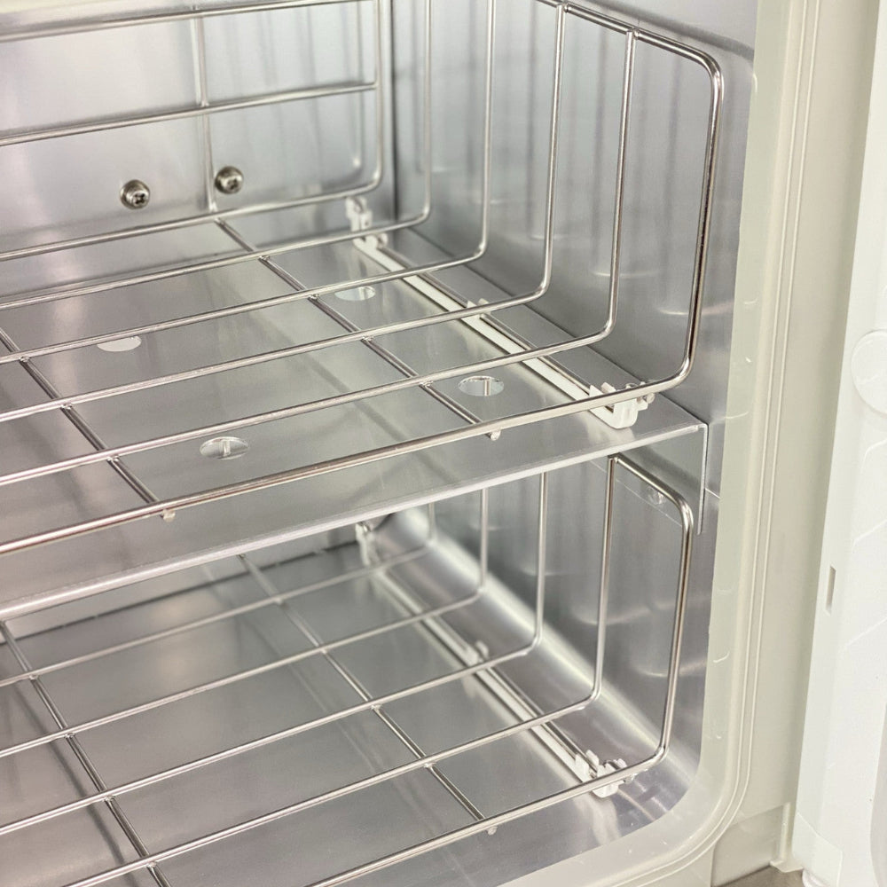 Detailed view of the hygienic stainless steel towel grills inside the Joiken warmer