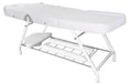 White Joiken Tulip beauty bed shown in flat position highlighting the under-bed rail storage shelf for towels