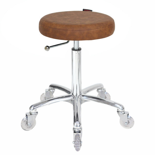 Professional tan upholstered cutting stool with chrome base and clear hair-proof wheels