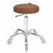 Professional tan upholstered cutting stool with chrome base and clear hair-proof wheels