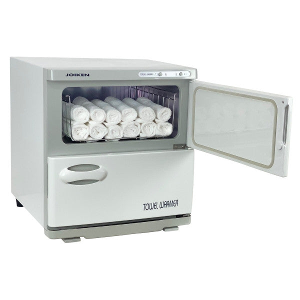 White Joiken towel warmer with top door open and towels ready for salon use
