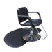 Black semi circular anti fatigue hairdressing mat positioned under a professional salon chair