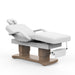 Karma Bethels Beach white electric beauty bed with wood panel base and paper roll holder