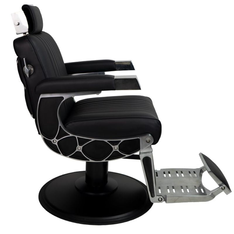 Side profile of the Karma Chandler barber chair showing the reclining mechanism and frame detail